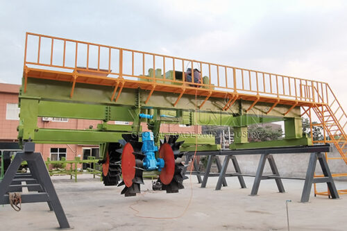 Wheel type compost turner for large scale organic composting